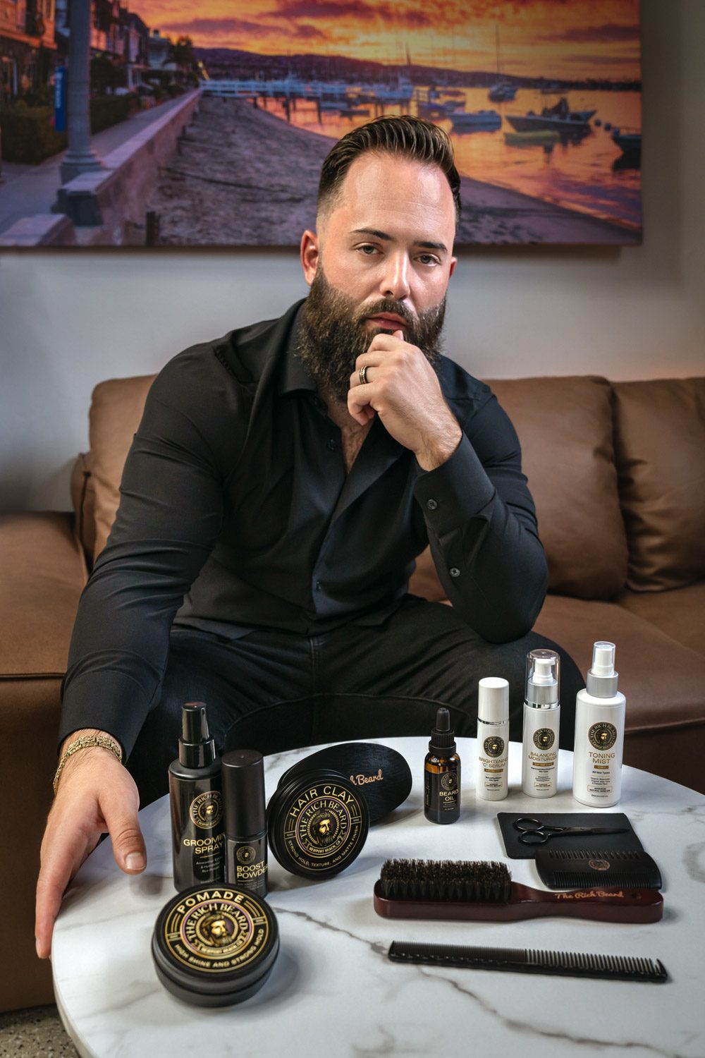 Chad Levin, founder of The Rich Beard, with The Rich Beard grooming products